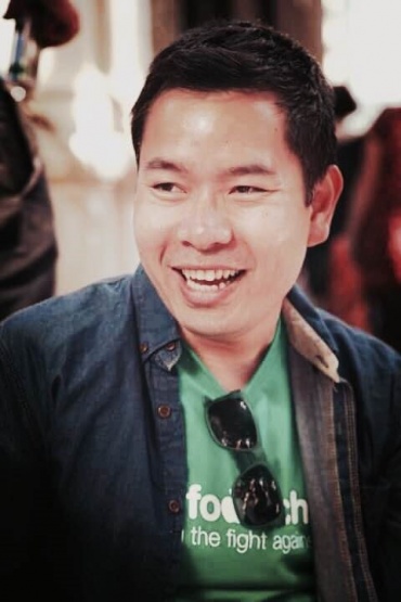 Ben, smiling, looking off to to the side